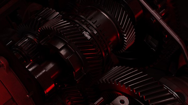 Детален преглед на менувачите и механичките делови на целосно хибридниот E-Tech мотор на новиот Renault Clio во црвено-црна боја.