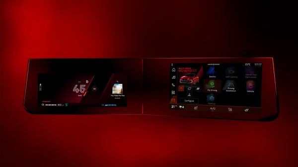 Дигитален систем openR link во возилото со два 10-инчни екрани што прикажуваат навигација и мени на црвена позадина